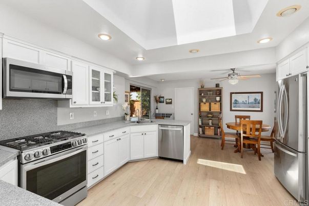 Dining room, Interior, Kitchen, Recessed Lighting, Stainless Steel Appliances, Wood Texture Flooring