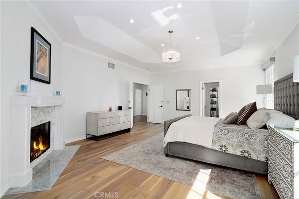 Bedroom, Chandelier, Fireplace, Interior, Recessed Lighting, Wood Texture Flooring