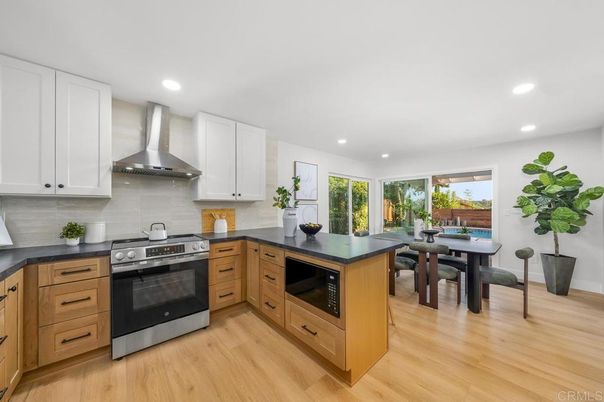 Dining room, Interior, Kitchen, Recessed Lighting, Stainless Steel Appliances, Wood Texture Flooring
