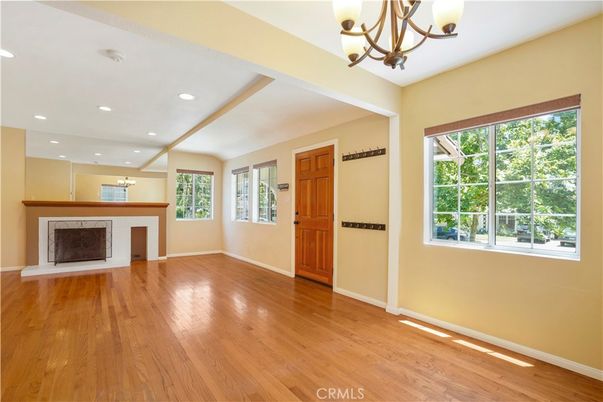 Chandelier, Empty room, Fireplace, Interior, Recessed Lighting, Wood Texture Flooring