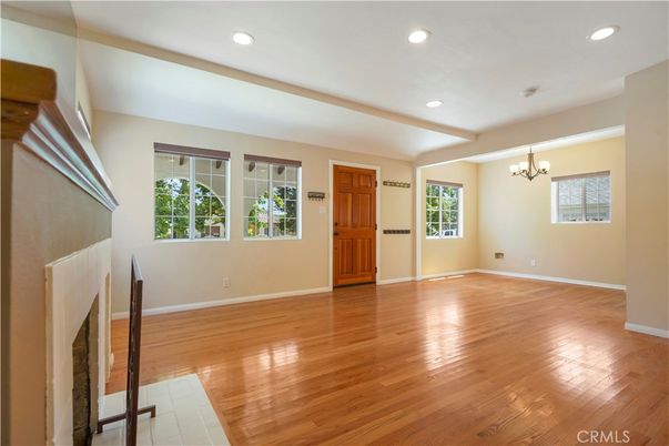 Chandelier, Empty room, Fireplace, Interior, Recessed Lighting, Wood Texture Flooring