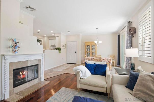 Chandelier, Dining room, Fireplace, Interior, Living room, Pendant Lights, Recessed Lighting, Wood Texture Flooring