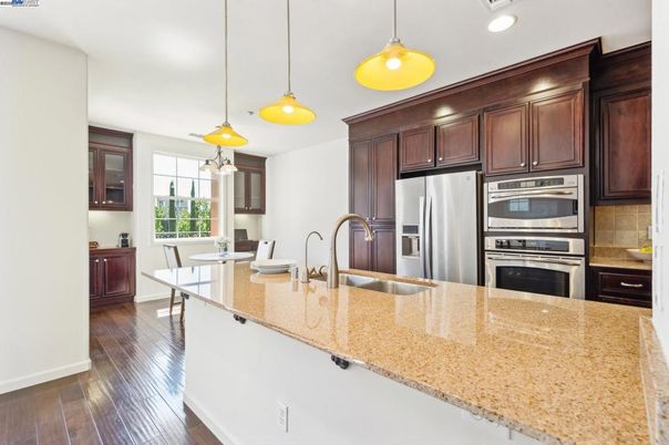 Dining room, Interior, Kitchen, Pendant Lights, Recessed Lighting, Stainless Steel Appliances, Wood Texture Flooring