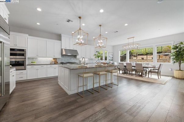Dining room, Interior, Kitchen, Pendant Lights, Recessed Lighting, Stainless Steel Appliances, Wood Texture Flooring