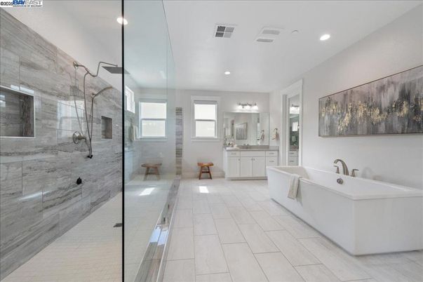 Bathroom, Dual Sink Vanities, Free Standing Baths, Glass Shower, Interior, Marble Walls, Recessed Lighting