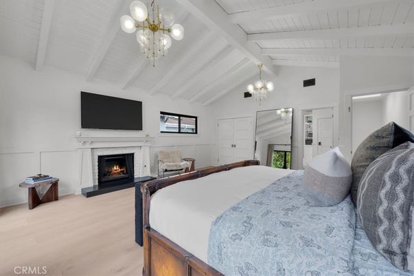 Bedroom, Chandelier, Fireplace, Interior, Wood Texture Flooring