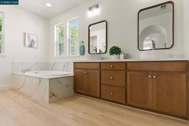 Bathroom, Dual Sink Vanities, Interior, Marble Walls, Recessed Lighting, Wood Texture Flooring