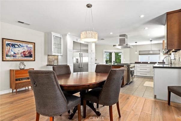 Dining room, Interior, Kitchen, Pendant Lights, Recessed Lighting, Stainless Steel Appliances, Wood Texture Flooring