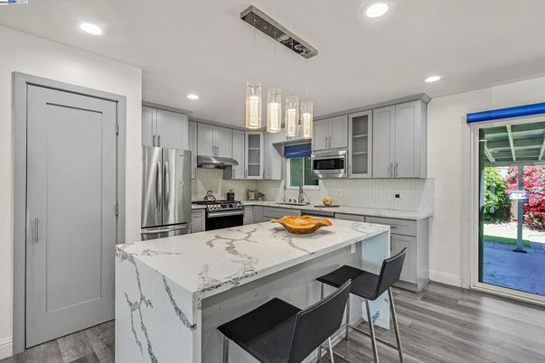 Interior, Kitchen, Pendant Lights, Recessed Lighting, Stainless Steel Appliances, Wood Texture Flooring
