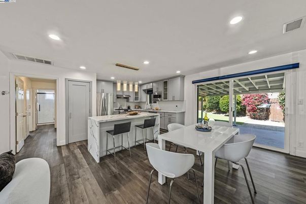 Dining room, Interior, Kitchen, Pendant Lights, Recessed Lighting, Stainless Steel Appliances, Wood Texture Flooring