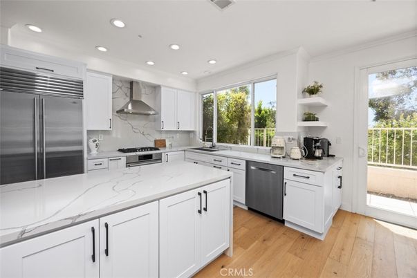 Interior, Kitchen, Marble Walls, Recessed Lighting, Stainless Steel Appliances, Wood Texture Flooring