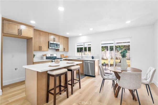 Dining room, Interior, Kitchen, Recessed Lighting, Stainless Steel Appliances, Wood Texture Flooring
