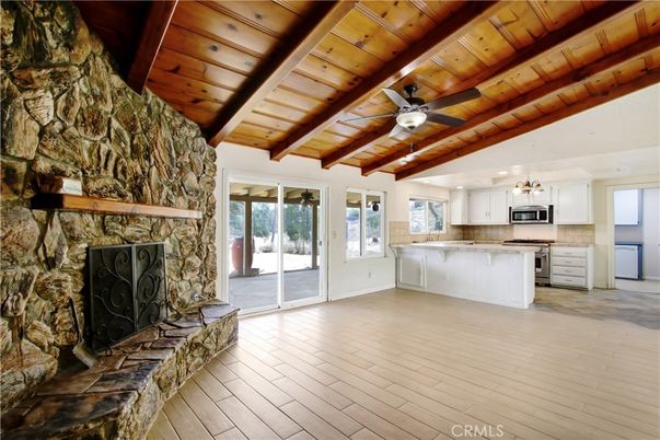 Empty room, Fireplace, Interior, Kitchen, Pendant Lights, Stone Walls, Wooden Beams, Wooden Ceilings, Wood Texture Flooring