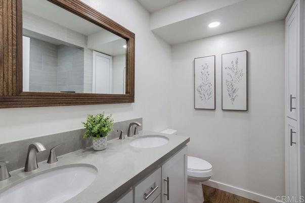 Bathroom, Dual Sink Vanities, Interior, Recessed Lighting, Wood Texture Flooring
