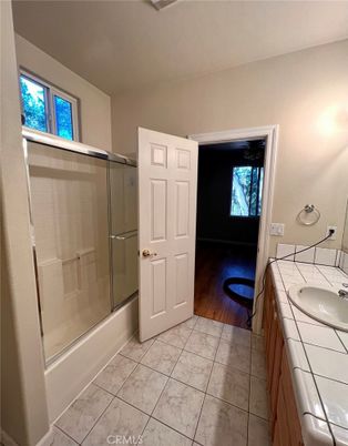 Bathroom, Glass Shower, Interior, Tile Countertops, Wood Texture Flooring