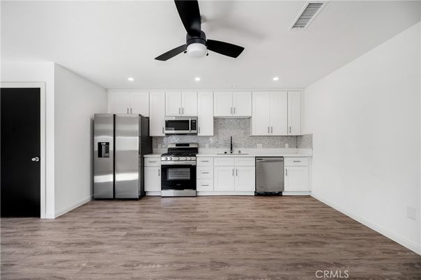 Interior, Kitchen, Recessed Lighting, Stainless Steel Appliances, Wood Texture Flooring