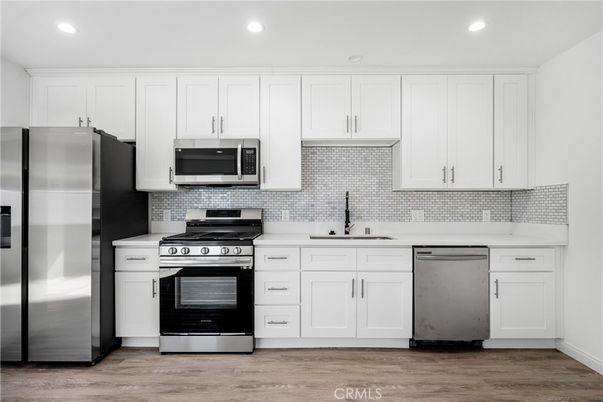 Interior, Kitchen, Recessed Lighting, Stainless Steel Appliances, Wood Texture Flooring