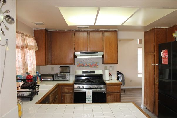 Interior, Kitchen, Tile Countertops, Wood Texture Flooring