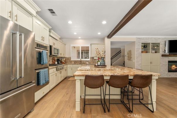 Fireplace, Interior, Kitchen, Recessed Lighting, Stainless Steel Appliances, Wooden Beams, Wood Texture Flooring