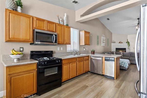 Fireplace, Interior, Kitchen, Living room, Stainless Steel Appliances, Wood Texture Flooring