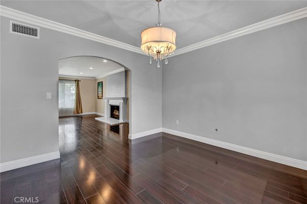Chandelier, Empty room, Fireplace, Interior, Recessed Lighting, Wood Texture Flooring
