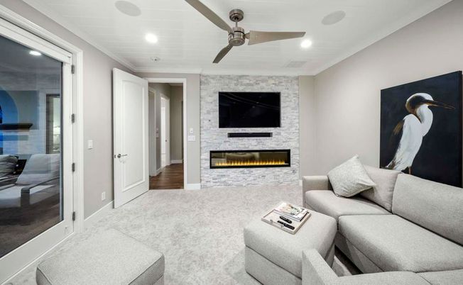 Fireplace, Interior, Living room, Recessed Lighting, Stone Walls, Wood Texture Flooring
