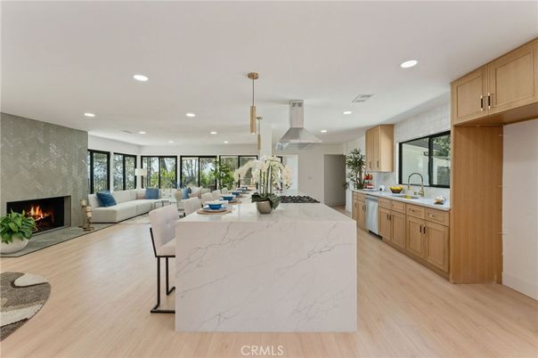 Dining room, Fireplace, Interior, Kitchen, Living room, Pendant Lights, Recessed Lighting, Stainless Steel Appliances, Wood Texture Flooring