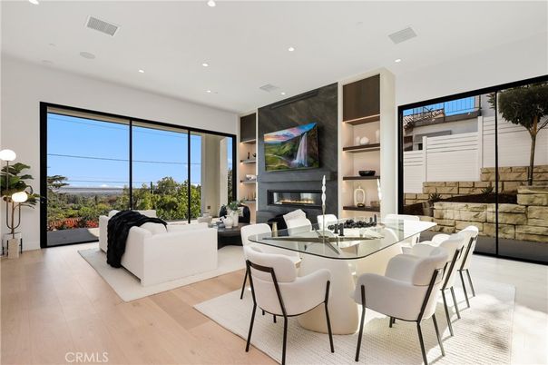 Dining room, Fireplace, Interior, Living room, Recessed Lighting, Wood Texture Flooring