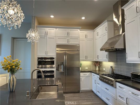 Chandelier, Interior, Kitchen, Pendant Lights, Recessed Lighting, Stainless Steel Appliances, Wood Texture Flooring