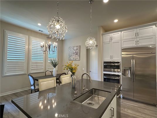 Chandelier, Dining room, Interior, Kitchen, Pendant Lights, Recessed Lighting, Stainless Steel Appliances, Wood Texture Flooring