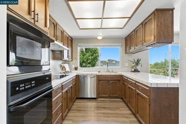 Interior, Kitchen, Stainless Steel Appliances, Tile Countertops, Wood Texture Flooring