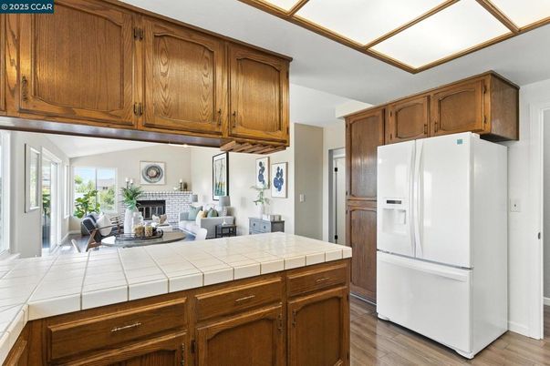 Fireplace, Interior, Kitchen, Living room, Tile Countertops, Wood Texture Flooring