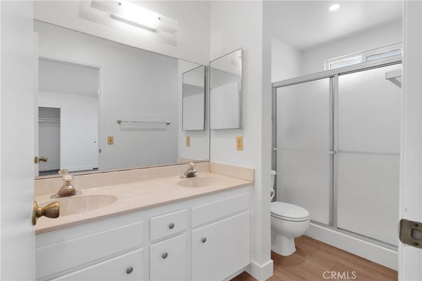 Bathroom, Dual Sink Vanities, Glass Shower, Interior, Recessed Lighting, Wood Texture Flooring