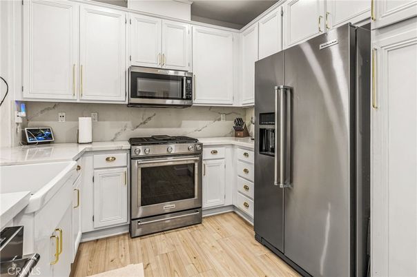 Interior, Kitchen, Marble Walls, Stainless Steel Appliances, Wood Texture Flooring