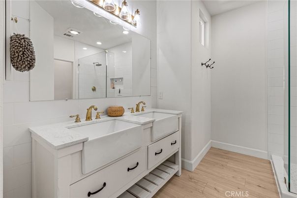 Bathroom, Dual Sink Vanities, Glass Shower, Interior, Recessed Lighting, Wood Texture Flooring