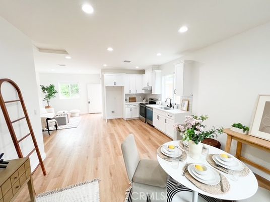 Dining room, Interior, Kitchen, Living room, Recessed Lighting, Stainless Steel Appliances, Wood Texture Flooring