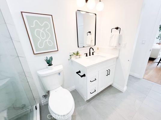 Bathroom, Dual Sink Vanities, Glass Shower, Interior, Wood Texture Flooring