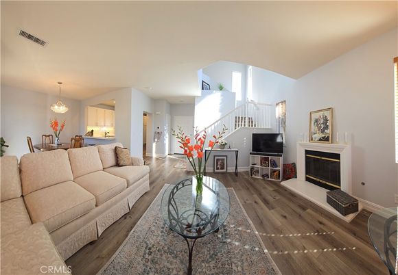 Chandelier, Dining room, Fireplace, Interior, Living room, Recessed Lighting, Wood Texture Flooring