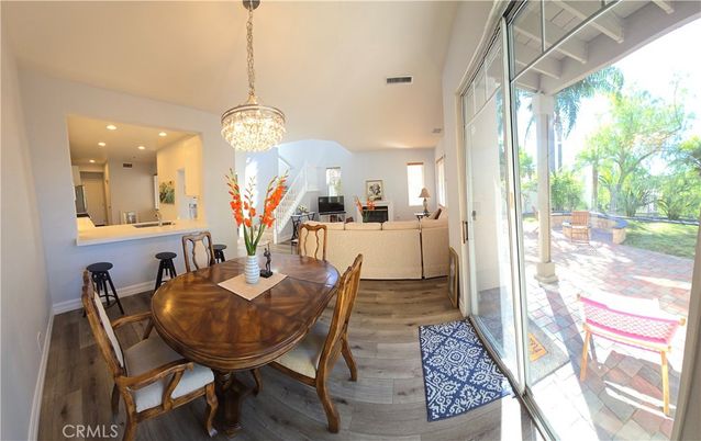 Chandelier, Dining room, Interior, Living room, Pendant Lights, Recessed Lighting, Wood Texture Flooring