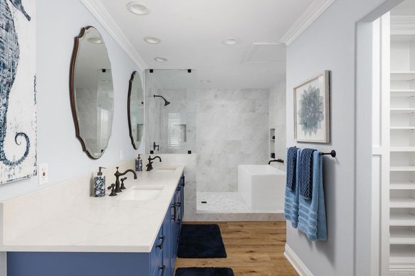 Bathroom, Dual Sink Vanities, Interior, Marble Walls, Recessed Lighting, Wood Texture Flooring