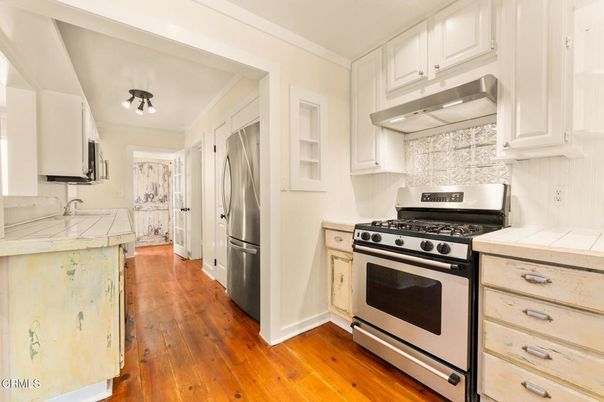 Interior, Kitchen, Stainless Steel Appliances, Tile Countertops, Wood Texture Flooring