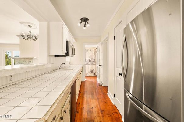 Chandelier, Interior, Kitchen, Tile Countertops, Wood Texture Flooring