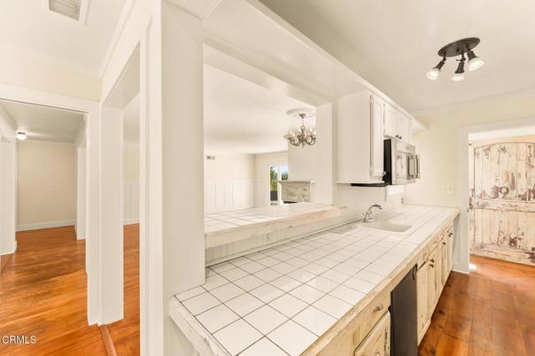 Chandelier, Interior, Kitchen, Tile Countertops, Wood Texture Flooring