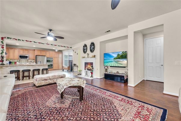 Fireplace, Interior, Kitchen, Recessed Lighting, Stainless Steel Appliances, Wood Texture Flooring