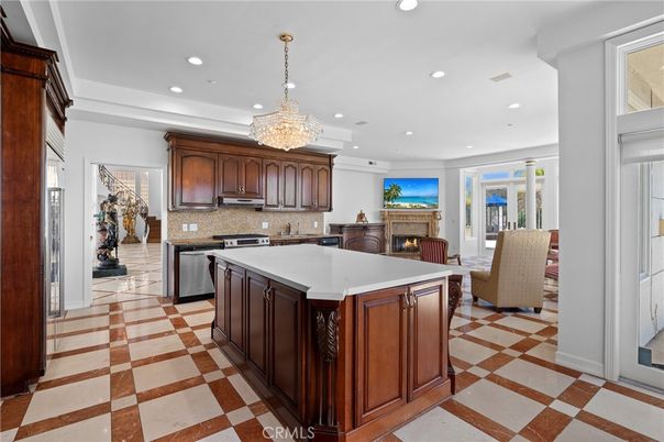Chandelier, Fireplace, Interior, Kitchen, Living room, Recessed Lighting, Stainless Steel Appliances