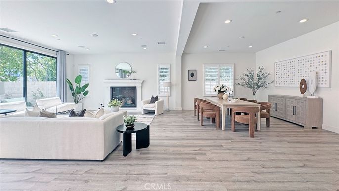 Dining room, Fireplace, Interior, Living room, Recessed Lighting, Wood Texture Flooring