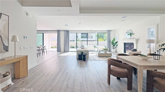 Dining room, Fireplace, Interior, Living room, Recessed Lighting, Wood Texture Flooring