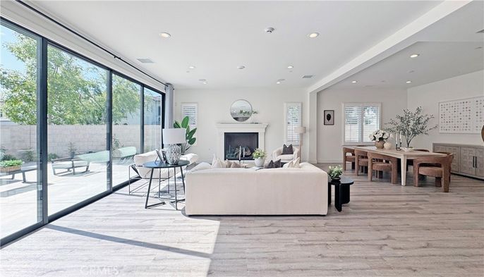 Dining room, Fireplace, Interior, Living room, Recessed Lighting, Wood Texture Flooring