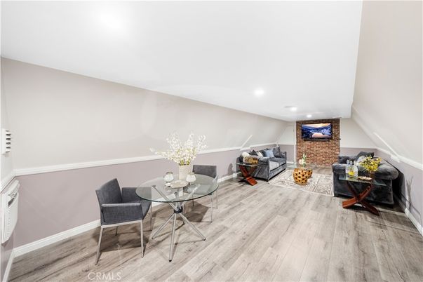 Dining room, Interior, Living room, Recessed Lighting, Stone Walls, Wood Texture Flooring