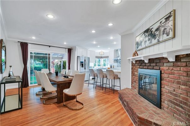 Dining room, Fireplace, Interior, Kitchen, Recessed Lighting, Stainless Steel Appliances, Stone Walls, Wood Texture Flooring